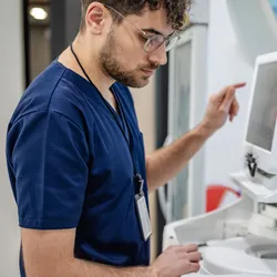 Laboratory technician using high-resolution mass spectrometry equipment