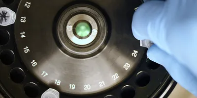 Defocused close-up of a laboratory centrifuge with tubes