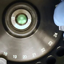 Defocused close-up of a laboratory centrifuge with tubes