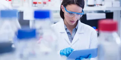 Female lab technician implementing EHS strategy