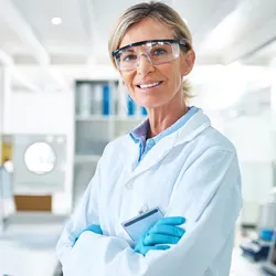 Chemist engaged in safety-focused laboratory work