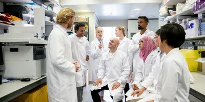 Group of lab workers discussing safety awareness