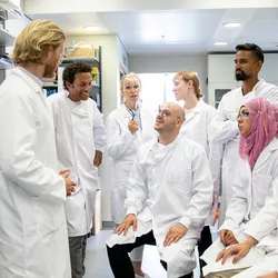 Group of lab workers discussing safety awareness