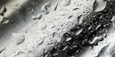 Water drops on metal surface.