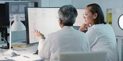 Researchers analyzing data for ethical drug development