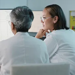 Researchers analyzing data for ethical drug development