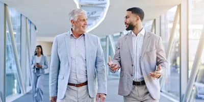 Two professionals engaged in mentorship discussion