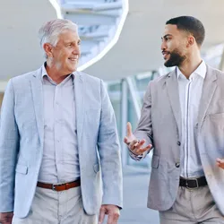Two professionals engaged in mentorship discussion