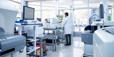 Scientist managing lab equipment and instruments