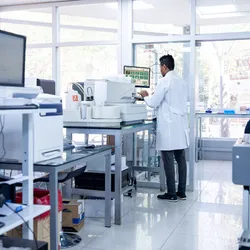 Scientist managing lab equipment and instruments