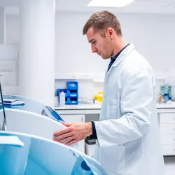 Researcher using innovative machine in a pathological anatomy laboratory 
