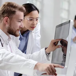 Lab professionals accessing agentic AI technology on a computer