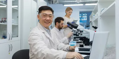 Group of researchers celebrating World Laboratory Day 2026 in a lab