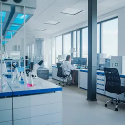 Modern laboratory with a researcher at a workstation