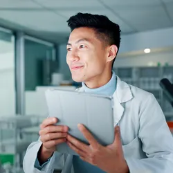 Professional in lab focusing on innovative staffing strategies