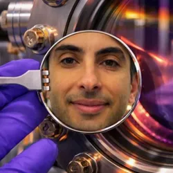 Lab technician examining neuromorphic computing setup
