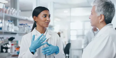 Lab managers engaging in conversation to improve employee retention