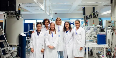 Group of researchers in lab coats representing lab staff management