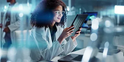 Motivated lab employee working on a tablet