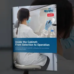 Woman scientist working in a biosafety cabinet