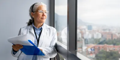 Lab manager reflecting on employee well-being in the workplace