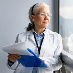 Lab manager reflecting on employee well-being in the workplace