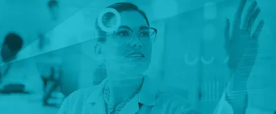 A woman assessing cloud LIMS solutions