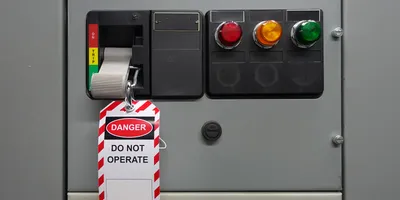 Lockout tagout device on equipment, indicating danger and maintenance