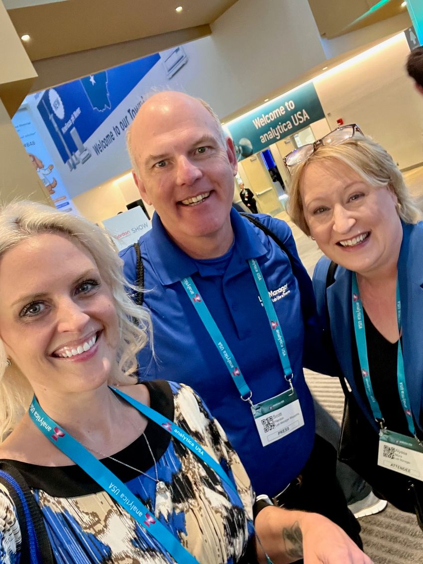 From left: Kelsey Ohle, Scott Hanton, and Alyssa Moore pose for a selfie together during a tradeshow.