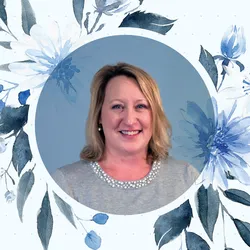 Portrait headshot of Alyssa Moore with blue flowers surrounding it