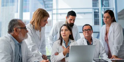 Laboratory personnel collaborating on compliance and quality practices