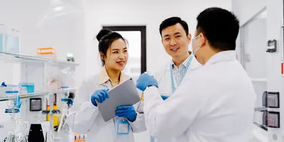 Colleagues discussing lab safety and peer lab inspections