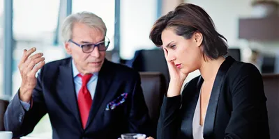 Tense discussion between a boss and an employee reflecting toxic leadership