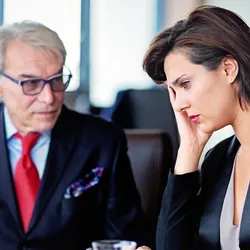 Tense discussion between a boss and an employee reflecting toxic leadership