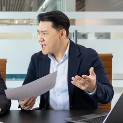 A frustrated employee during a tense lab management discussion