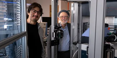 Researchers with automated desorption electrospray ionization system