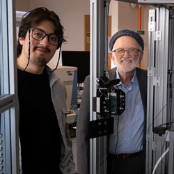 Researchers with automated desorption electrospray ionization system