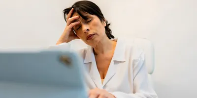 Laboratory employee experiencing burnout at work