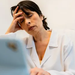 Laboratory employee experiencing burnout at work