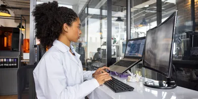 Female researcher working at a 3D printing laboratory