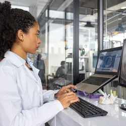 Female researcher working at a 3D printing laboratory