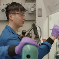 Researchers working on electrochemical carbon capture in a laboratory