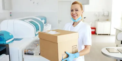 A lab technician managing delivery logistics in a laboratory