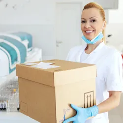 A lab technician managing delivery logistics in a laboratory