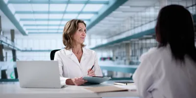 Laboratory hiring discussion illustrating candidate talent evaluation