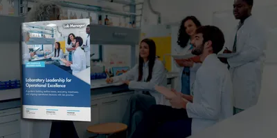 Diverse group of young adult students listening to their mature adult professor during a chemistry lecture in a lab