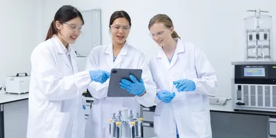 Scientists collaborating on safety training topics in a lab