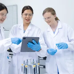 Scientists collaborating on safety training topics in a lab