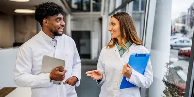 Diverse team of scientists engaging in conversation about workplace support