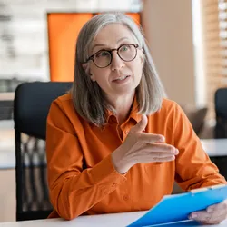 Hiring manager conducting a structured interview with a candidate about AI in hiring.